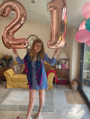 a young woman who is celebrating her birthday after being told she no longer has blood cancer