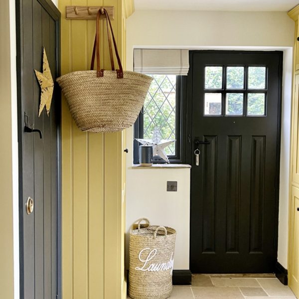 laundry basket in a yellow utility room