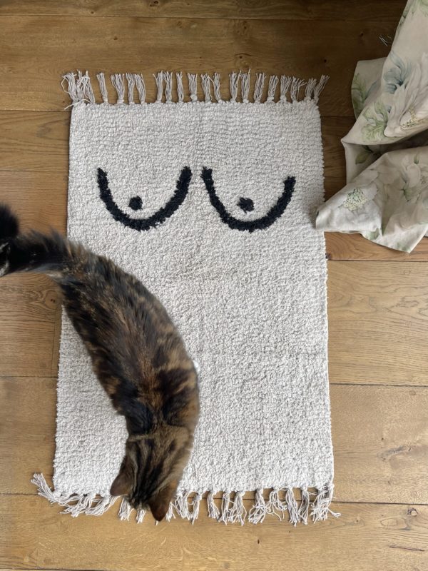 a cotton mat with boobs on